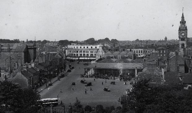 Darlington and Stockton Times: Darlington Market Place from the top of St Cuthbert's Church tower in the 1930s, when Joseph Pease had his sports shop in Horsemarket